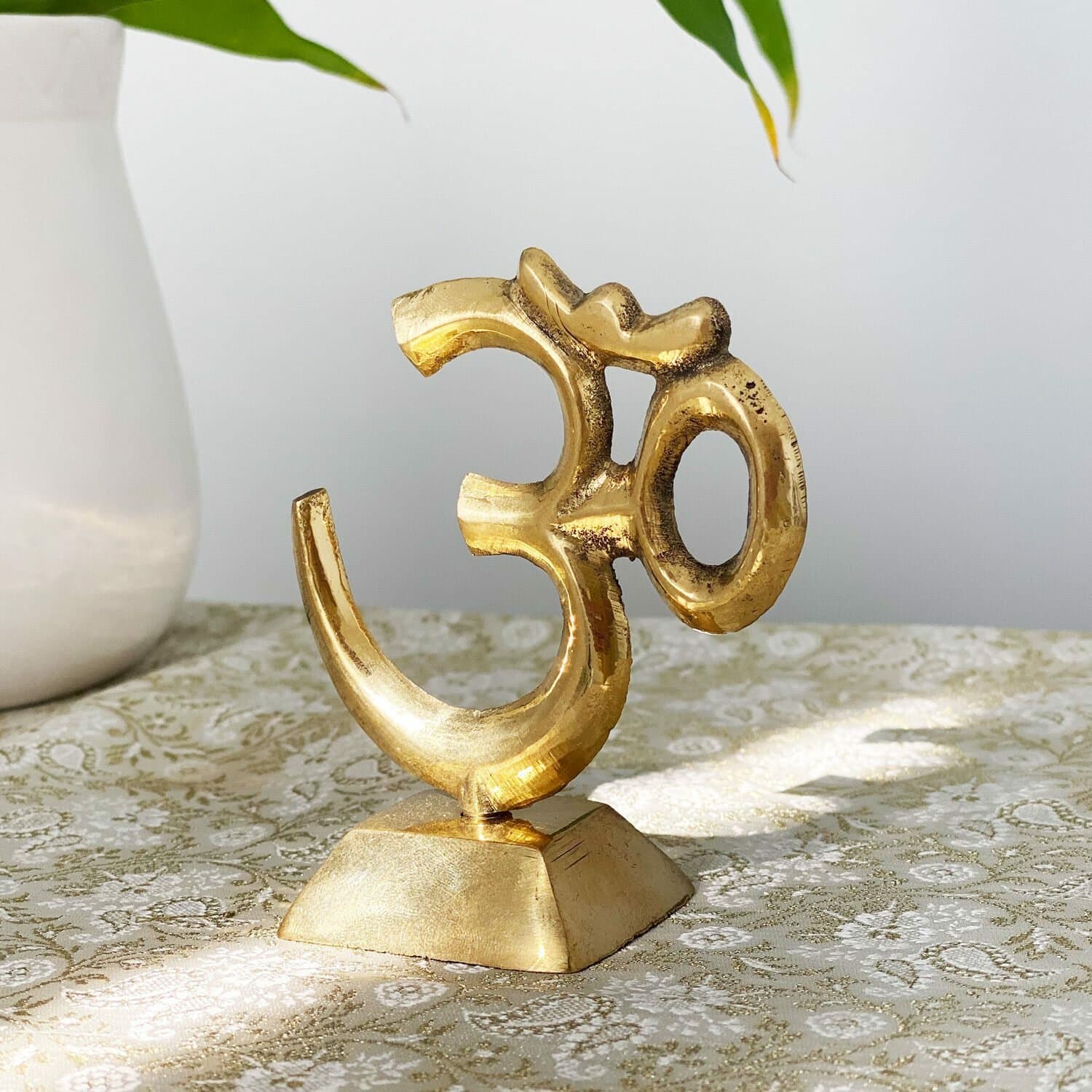 undefined | Símbolo Om com pedestal - Bronze